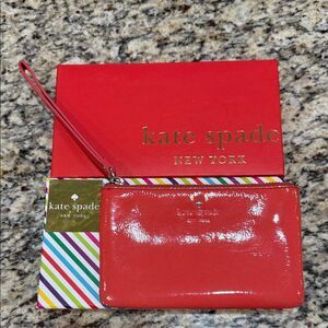 Kate Spade Glossy Harrison Street Wristlet in carnelian comes with gift box